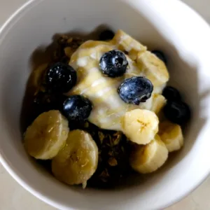 baked oats in a bowl with yoghurt and fruit